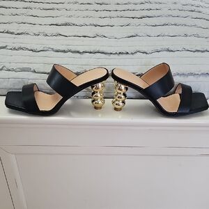 Chic Black Heels with Gold Spiral Accents